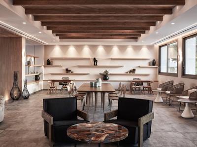 Modernes Hotellounge mit Holzdecke, großen Fenstern und komfortablen Sitzbereichen.