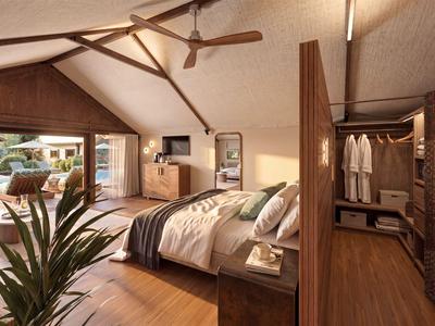 Modern eingerichtetes Hotelzimmer mit Holzboden, gemütlichem Bett und separatem begehbarem Kleiderschrank.