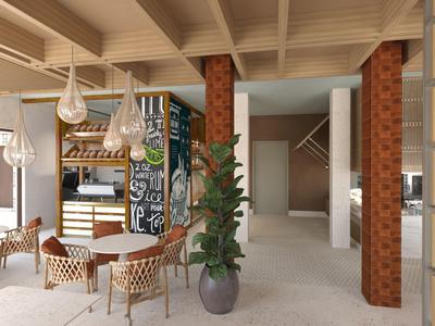 Moderní hotelová relaxační zóna s ratanovými židlemi, stoly, rostlinami a závěsnými skleněnými lampami.