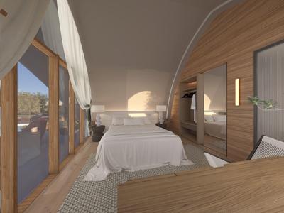 Moderní hotelový pokoj s manželskou postelí, dřevěným obložením a velkými okny s výhledem ven.