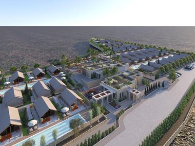 Luxusní plážové letovisko s moderními vilami a bazény podél pobřeží.