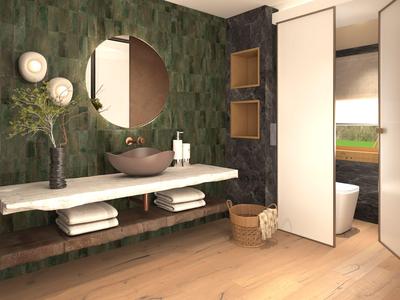 Moderní koupelna se zelenou vzorovanou zdí, kulatým zrcadlem a samostatným umyvadlem.