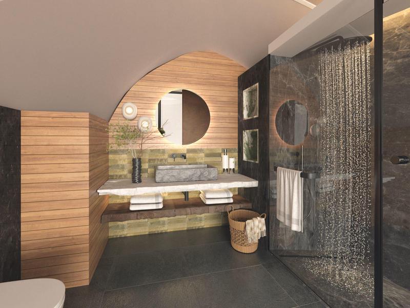 Moderní koupelna s dřevěnými akcenty, velkým sprchovým koutem a kulatým zrcadlem nad umyvadlem.