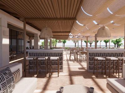 Terraza soleada con mesas, sillas y plantas en un restaurante de hotel.