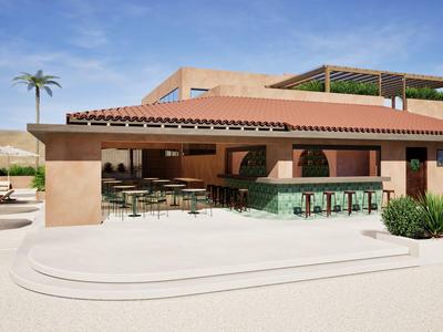 Área exterior moderna con bar cubierto y asientos junto a una piscina.