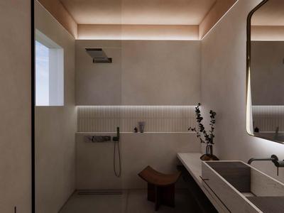 Baño moderno con diseño minimalista, tonos beige y iluminación indirecta.
