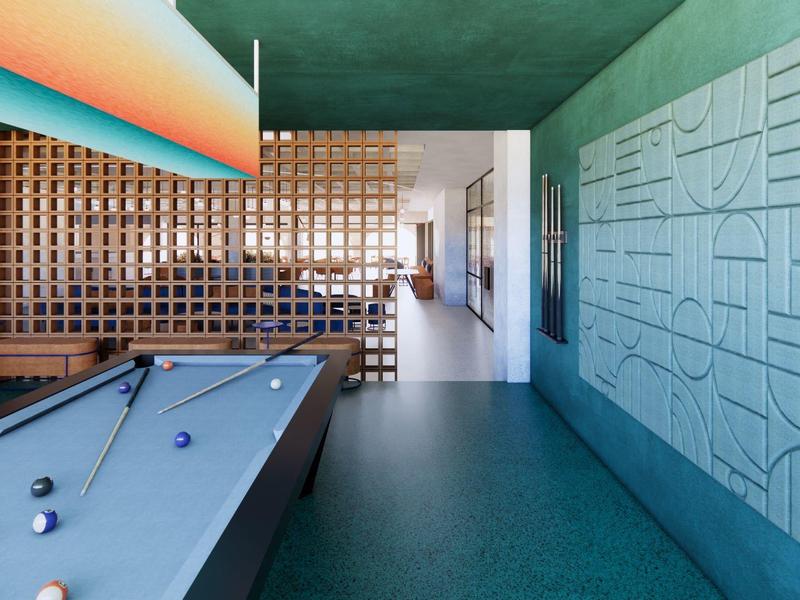 Sala moderna con mesa de billar verde, diseño artístico en la pared y paneles de madera.