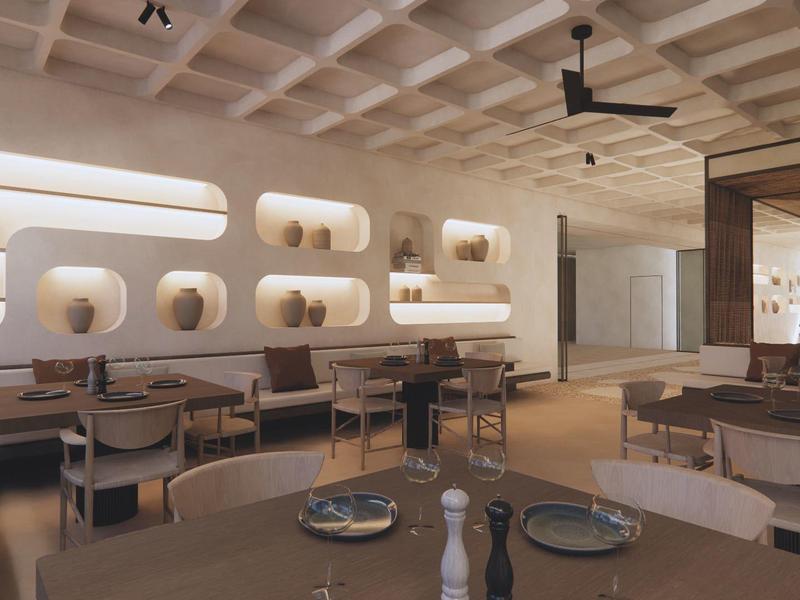 Restaurante moderno con mobiliario de madera clara e iluminación indirecta en la pared.