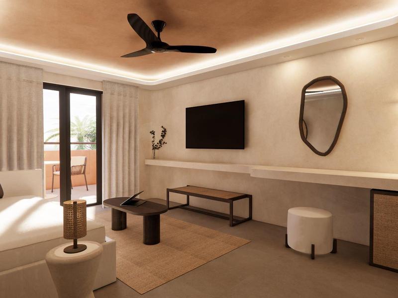 Habitación de hotel moderna con TV, espejo redondo en la pared, ventilador de techo y vista al balcón.