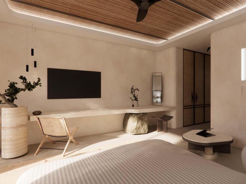 Habitación de hotel moderna y luminosa con techo de vigas de madera, gran televisor y zona de estar acogedora.