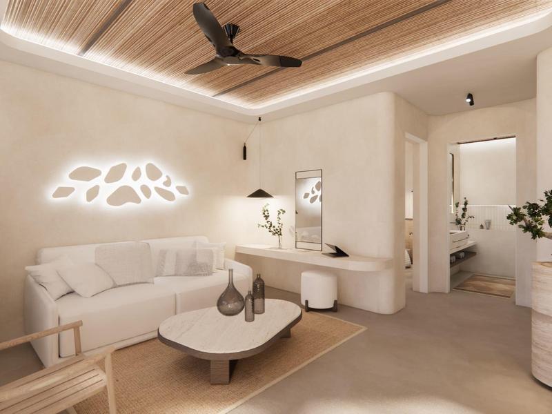 Sala de estar moderna con sofá blanco, mesa redonda y techo de madera con ventilador.