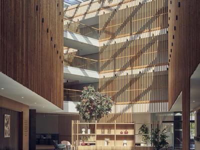 Modernes Hotelinterieur mit hoher Glasdecke, Holzvertäfelungen und gemütlichen Sitzbereichen.