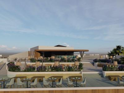 Moderne buitenterras met zitgedeeltes, uitzicht op uitgestrekt landschap en blauwe lucht.