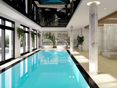 Moderner Innenpool mit großen Fenstern, grünen Pflanzen und entspannenden Sitzbereichen.