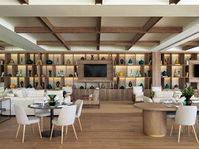 Area hotel moderna con pavimento in legno, dettagli al soffitto e comode sedie bianche ai tavoli.
