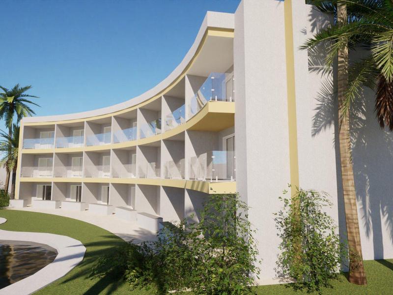 Modernes, dreigeschossiges Gebäude mit abgerundeter Fassade, umgeben von Palmen und Pool.