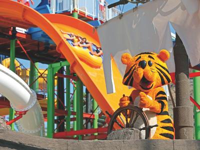 Colorful children's playground with slide and Tigger figure from Winnie the Pooh.