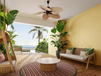 Gemütliche Terrasse mit Holzfußboden, Pflanzen und loungiger Sitzgruppe mit Blick aufs Meer.
