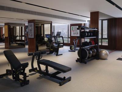 Nowoczesna siłownia z ławkami do ćwiczeń, hantlami i piłkami do ćwiczeń w stylowym wnętrzu.