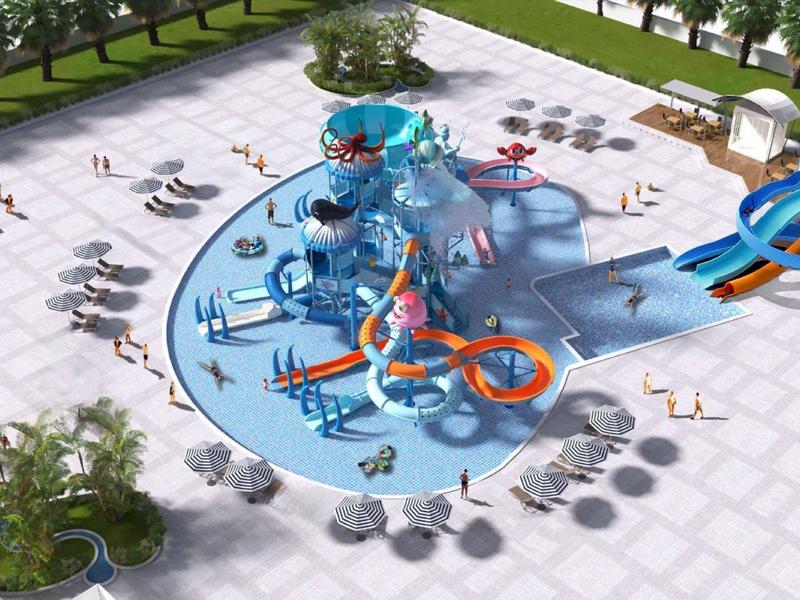 Area giochi acquatica colorata con scivoli e getti d'acqua in uno spazio esterno.