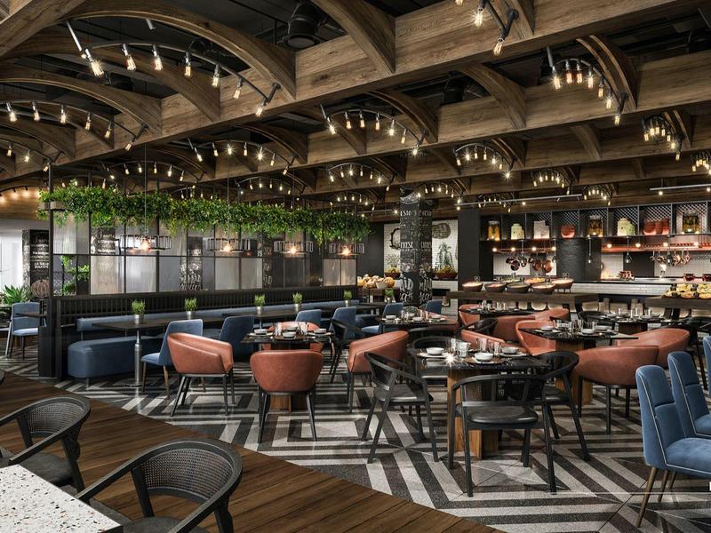 Großes Restaurant mit modernem Design, Holzboden, runden Tischen und bequemen Stühlen.