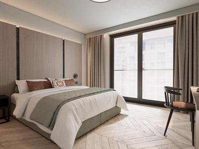 Chambre d'hôtel moderne avec grand lit, bureau et fenêtre du sol au plafond