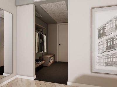 Couloir d'hôtel lumineux avec miroir, armoire et œuvre murale aux couleurs neutres.