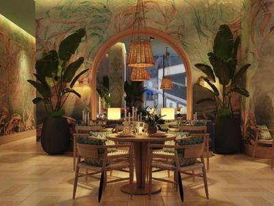 Ristorante elegante con murales tropicali, piante e illuminazione accogliente.