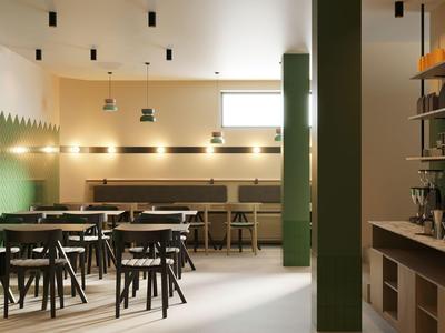 Sala da pranzo moderna con pareti verdi e mobili in legno.