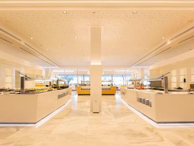 Bright, modern buffet area with spacious layout and warm lighting.