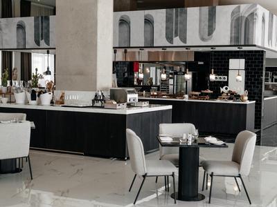 Modern hotelrestaurant met minimalistische tafels, comfortabele stoelen en een stijlvolle bar.