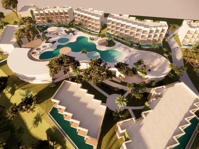 Luftaufnahme eines großen Resorts mit mehreren Gebäuden und einem großen Pool mit gewundenen Formen.