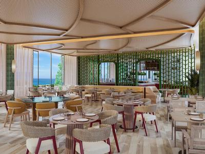 Área de restaurante de hotel moderno con sillas y mesas elegantes bajo un techo único.