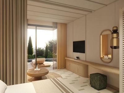 Habitación de hotel moderna con balcón, sillas cómodas y vista al jardín