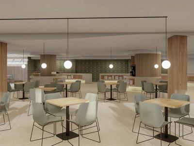 Modernes Hotelrestaurant mit runden Tischen, bequemen Stühlen und hängenden Kugellampen.