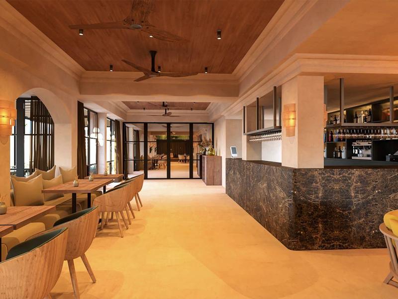 Ristorante d'hotel moderno con mobili in legno e bancone in marmo grigio scuro