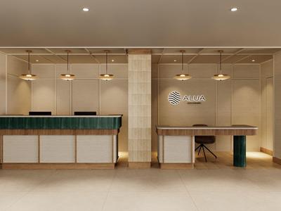 Modern hotel lobby reception area with front desk and workspace in neutral tones.