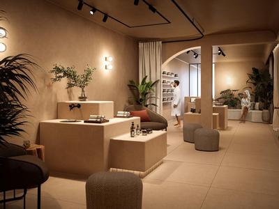 Moderner Verkaufsraum mit warmem Licht, minimalistischer Einrichtung und Pflanzen für Atmosphäre.