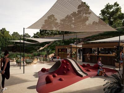 Moderner Spielplatz mit rotem Klettergerüst, Sonnensegeln und angrenzendem Kiosk im grünen Park.