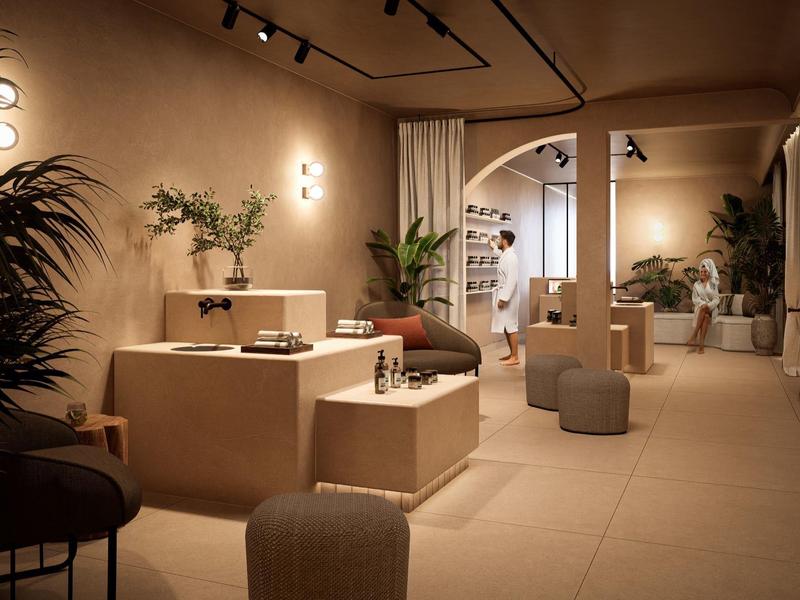 Moderner Verkaufsraum mit warmem Licht, minimalistischer Einrichtung und Pflanzen für Atmosphäre.