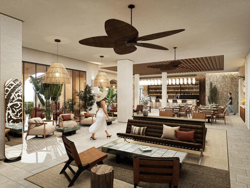 Großer, offener Raum mit modernem Lounge- und Bartresenbereich in warmen Naturtönen.