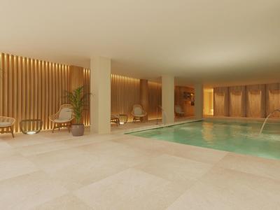 Moderner Innenpool mit hellem Natursteinboden, Holzpaneelen und gemütlichen Sitzbereichen.