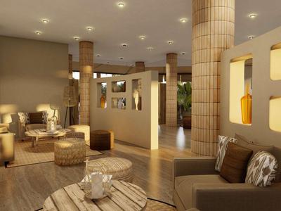 Hall d'hôtel moderne avec sièges confortables et éclairage chaleureux.