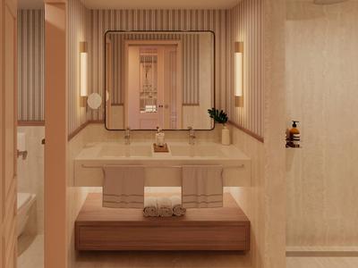 Moderne badkamer met dubbele wastafel, grote spiegel en beige ontwerp in een hotelkamer.