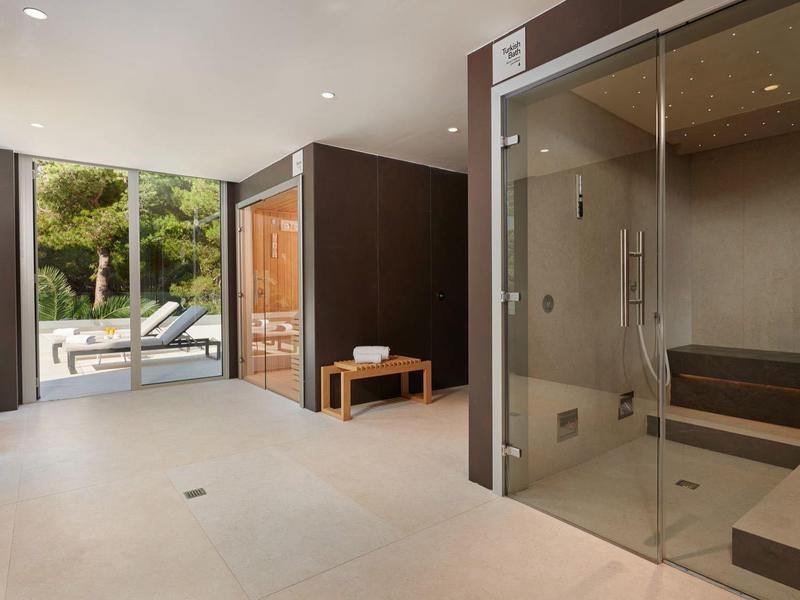 Modern spa with sauna and steam room, bright and minimalist design.
