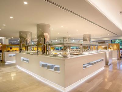 Bright, modern hotel buffet area with warm lighting and elegant design.