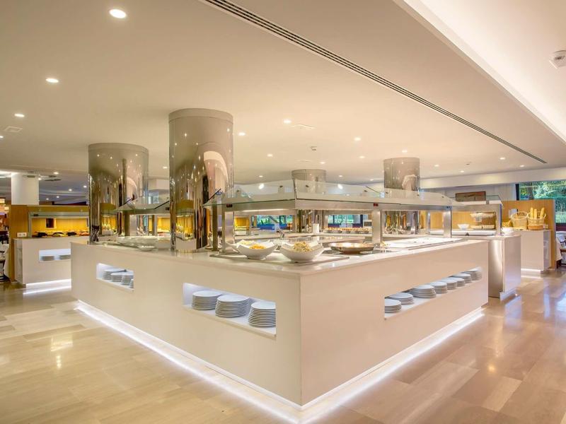 Bright, modern hotel buffet area with warm lighting and elegant design.
