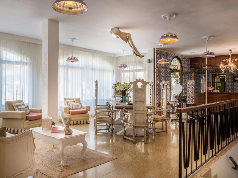 Elegant hotel restaurant with comfortable seating and large windows