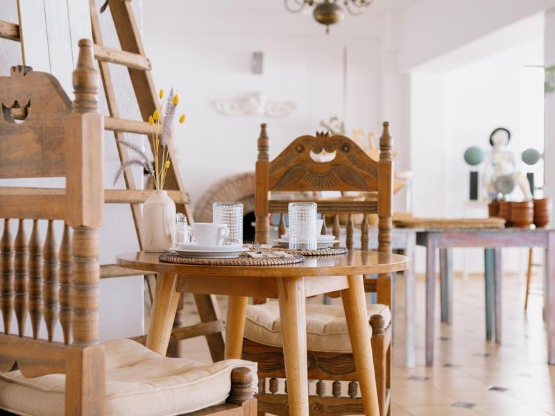 Bright dining room with rustic wooden furniture and natural light.