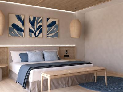 Camera d'albergo moderna con letto matrimoniale, accenti blu e arte murale contemporanea.